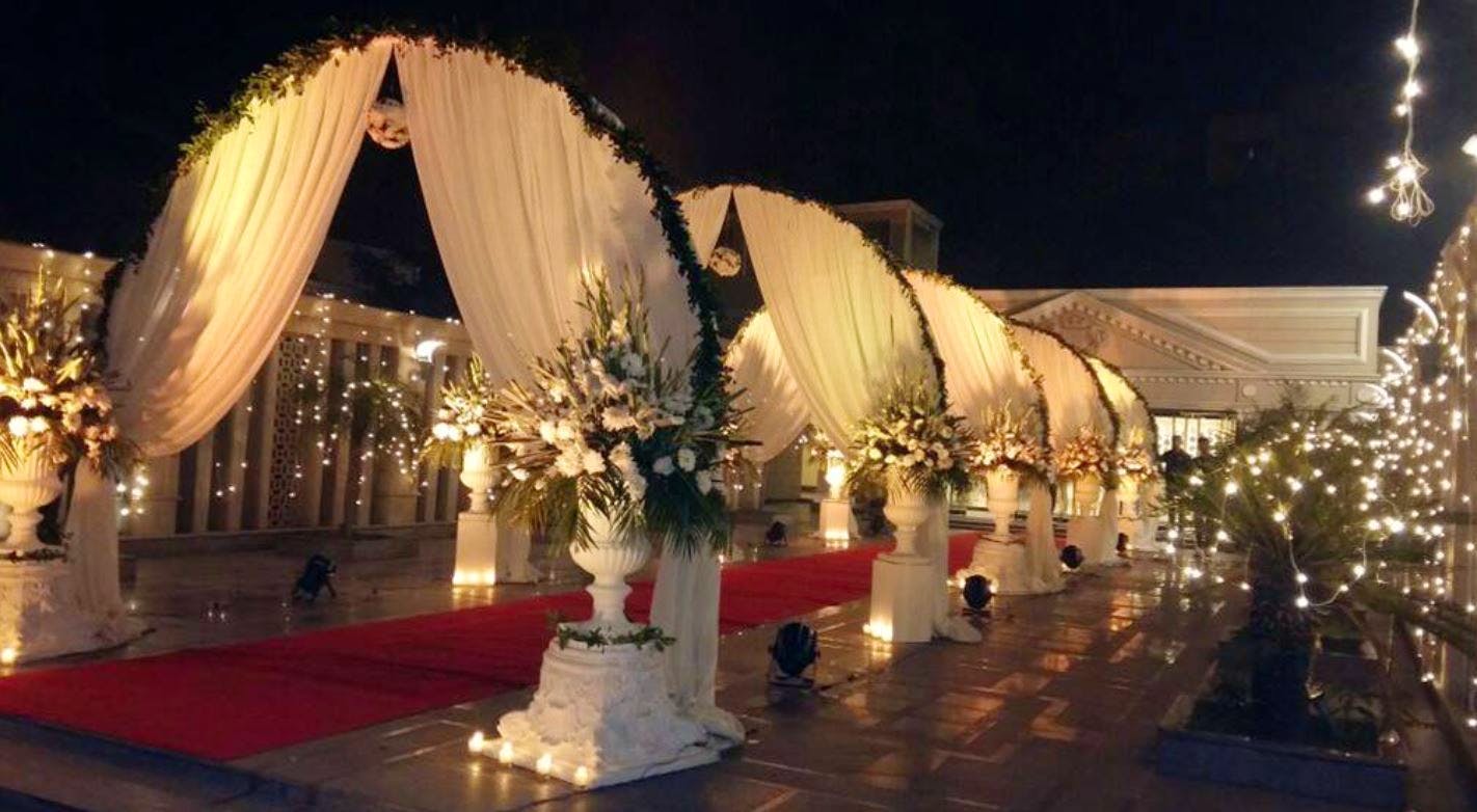 Decoration,Lighting,Function hall,Architecture,Ceremony,Wedding reception,Event,Stage,Night,Building