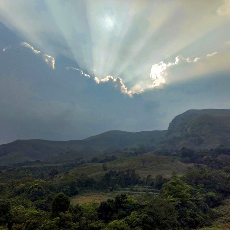 Sky,Mountainous landforms,Cloud,Highland,Mountain,Nature,Natural landscape,Hill,Atmospheric phenomenon,Light