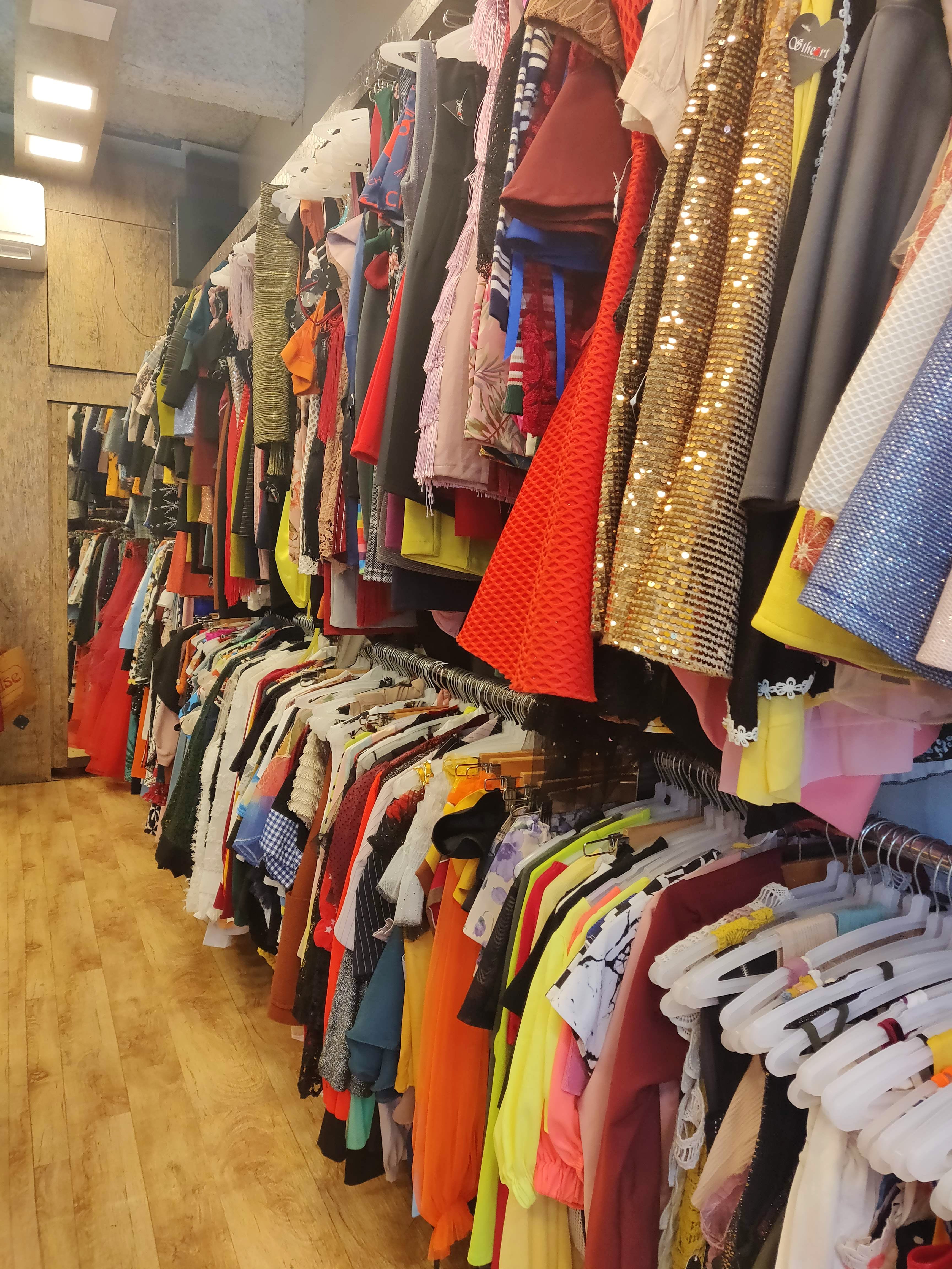 Boutique,Clothing,Room,Outlet store,Closet,Textile,Bazaar,Clothes hanger,Outerwear,Retail