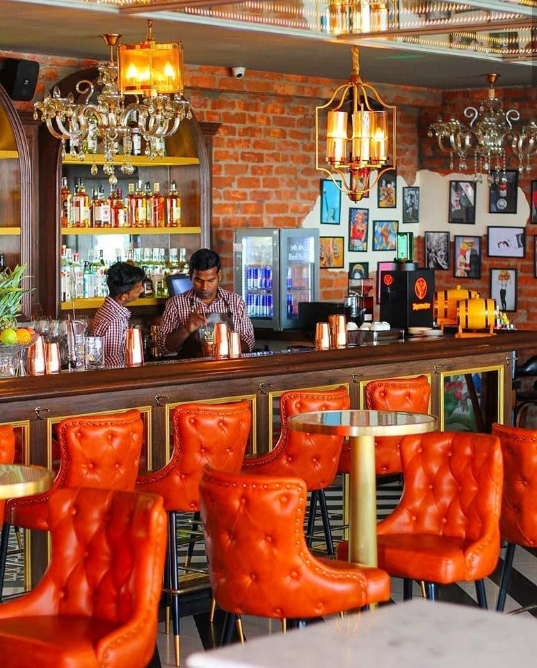 Bar,Orange,Room,Building,Interior design,Furniture,Restaurant,Table,Pub