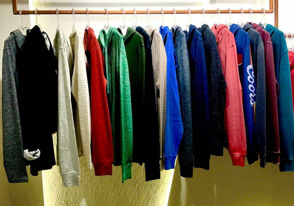 Clothing,Room,Clothes hanger,Textile,Boutique,Outerwear,Linens,Towel,T-shirt,Closet