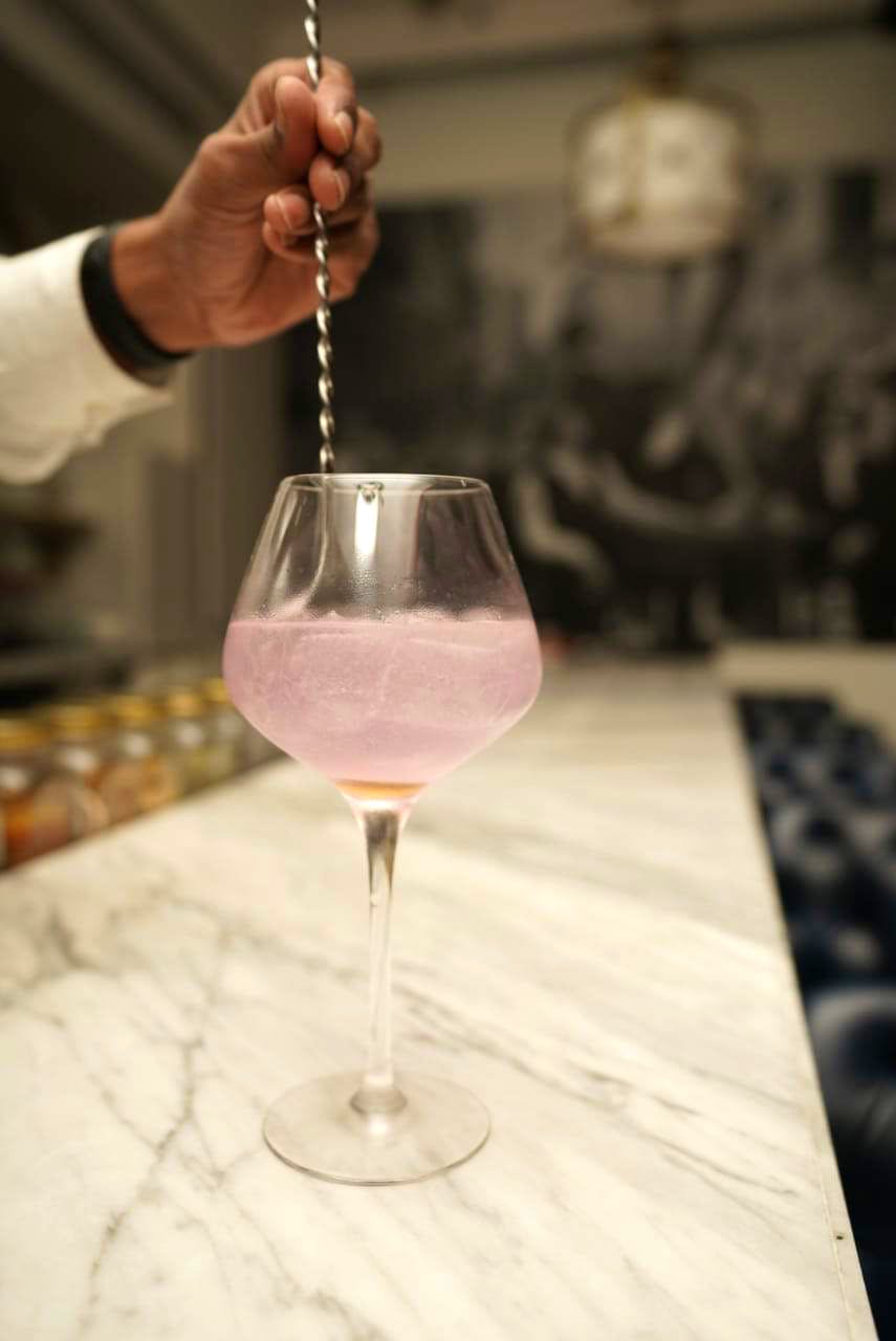 Drink,Wine glass,Glass,Stemware,Classic cocktail,Alcoholic beverage,Pink,Champagne stemware,Cocktail,Distilled beverage