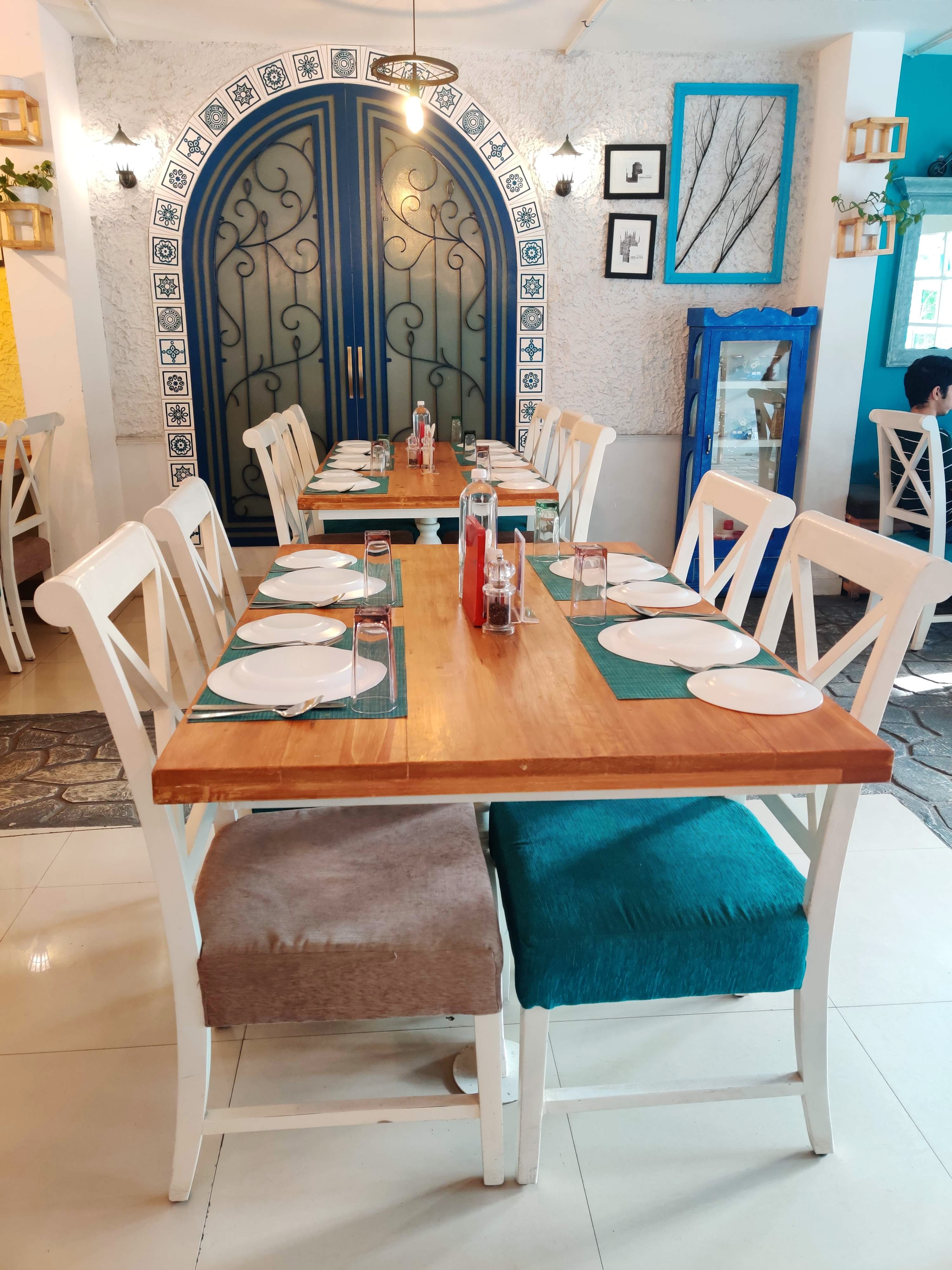 Furniture,Room,Table,Interior design,Blue,Dining room,Turquoise,Chair,Design,Building