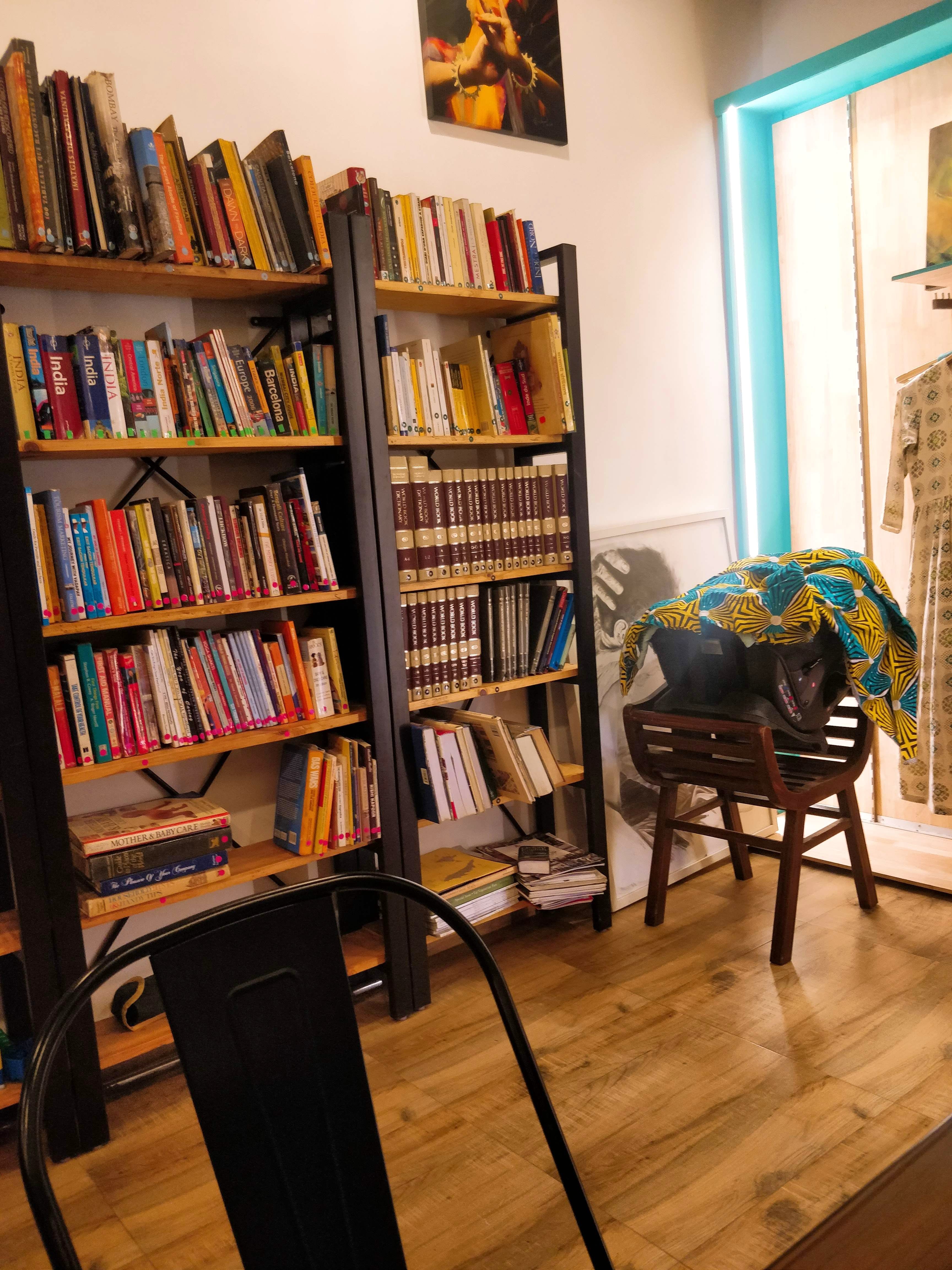 Bookcase,Shelving,Shelf,Furniture,Floor,Room,Hardwood,Flooring,Interior design,Wood flooring