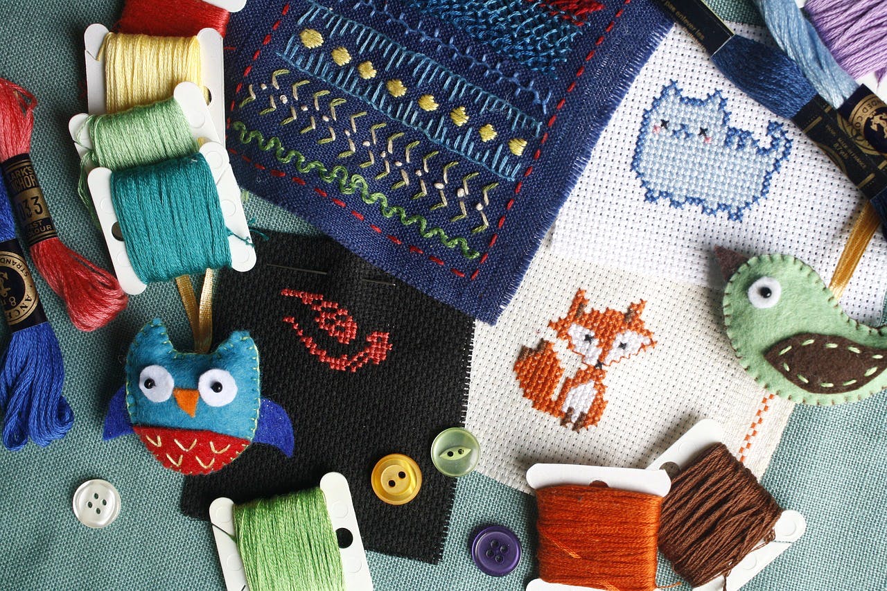 Crochet,Woolen,Wool,Textile,Knitting,Woven fabric,Needlework,Art,Toy,Pattern
