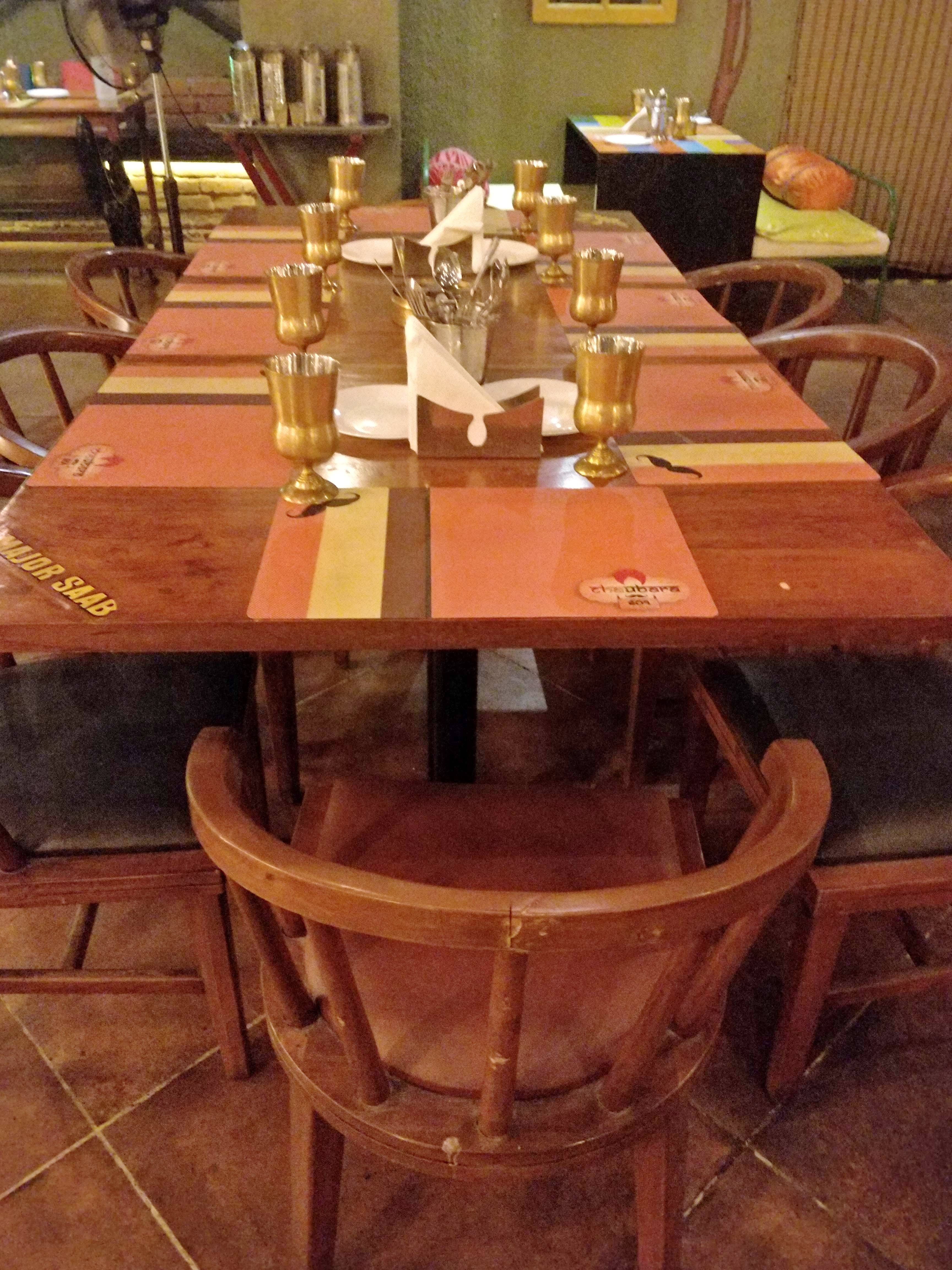 Table,Furniture,Chair,Room,Restaurant,Kitchen & dining room table,Hardwood,Wood,Dining room,Outdoor table