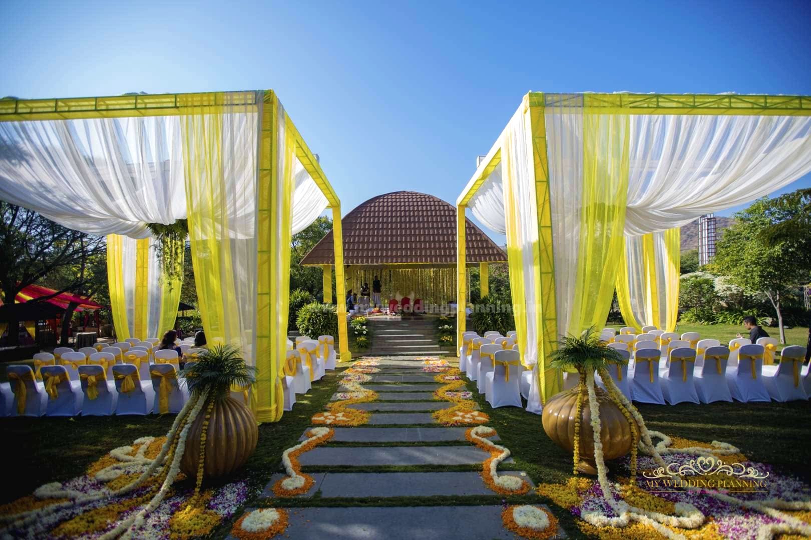 Yellow,Building,Architecture,Ceremony,Wedding reception,Tree,Aisle,Event,Landscape,House