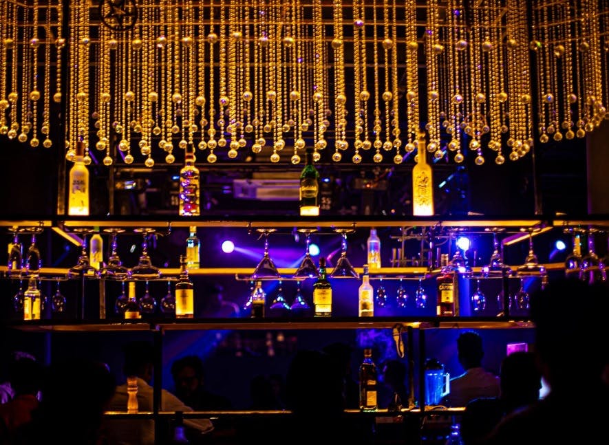 Bar,Lighting,Musical instrument accessory,Stage,Music venue,Architecture,Nightclub,Night,Event,Performance