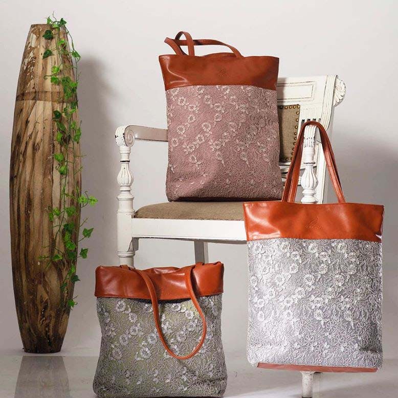 Bag,Textile,Linens,Room,Handbag,Furniture,Leather,Fashion accessory,Copper,Diaper bag