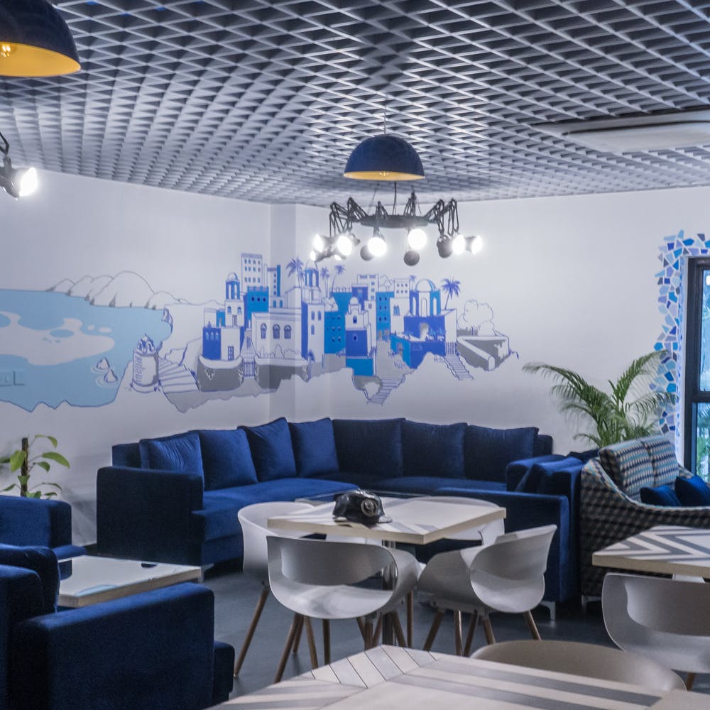 Blue,Interior design,Ceiling,Wall,Lighting,Restaurant,Room,Sky,Furniture,Building