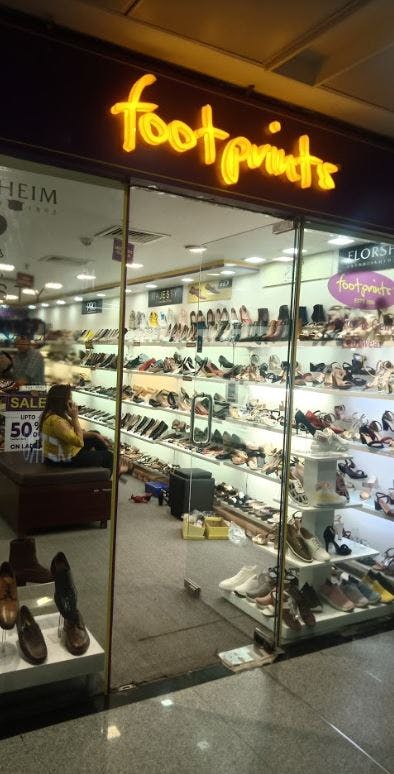 Footwear,Building,Shoe store,Retail,Eyewear,Outlet store,Shoe,Glasses,Display case,Fashion accessory