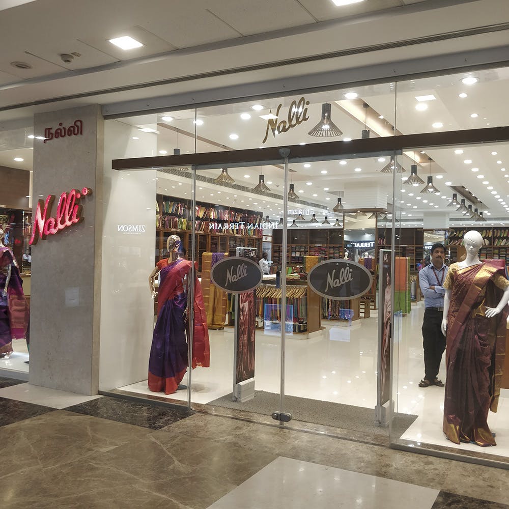 Boutique,Outlet store,Shopping mall,Building,Retail,Shopping,Display window,Interior design,Door