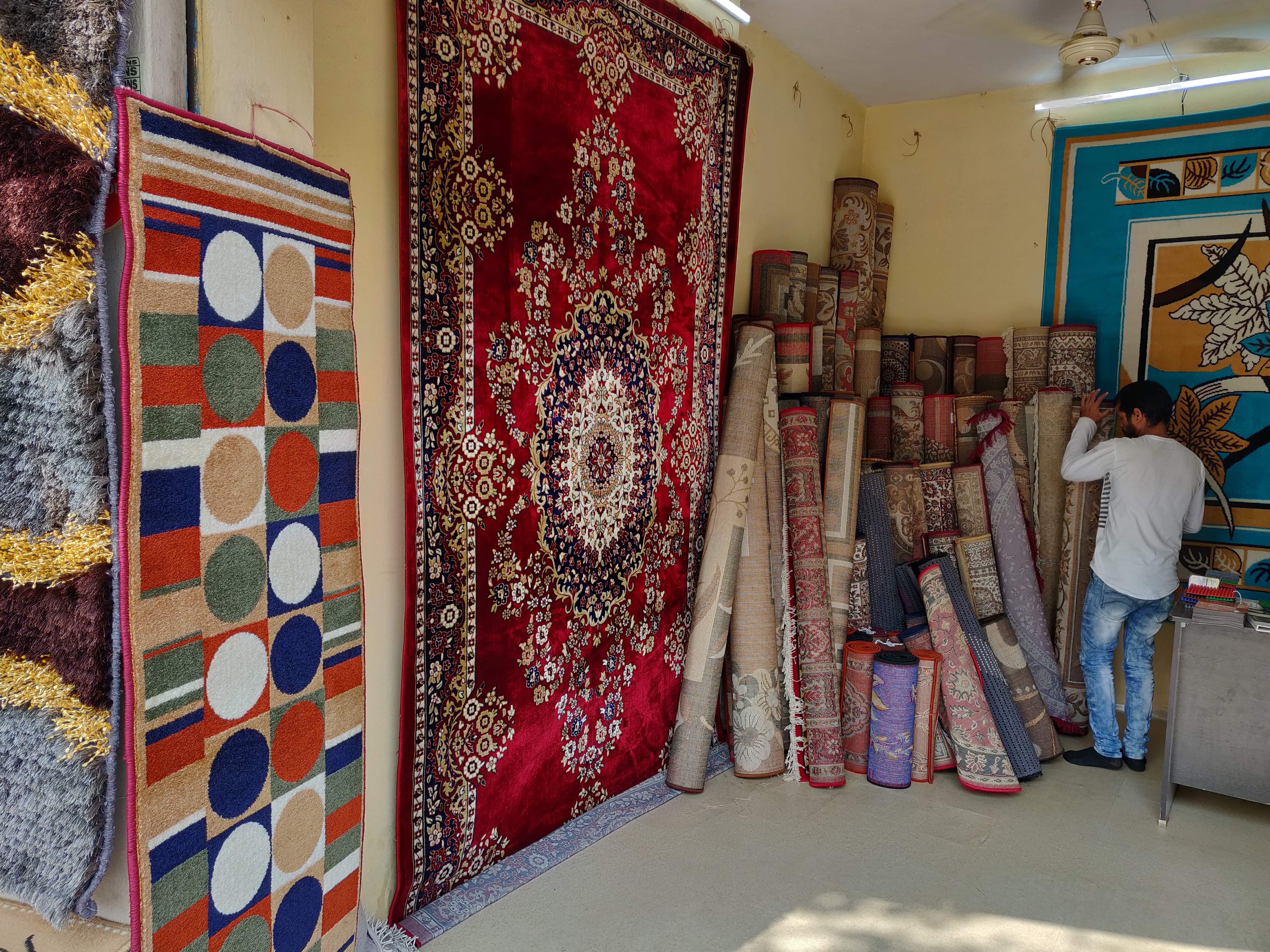 Textile,Art,Carpet,Wall,Interior design,Room,Visual arts,Tapestry,Linens,Flooring