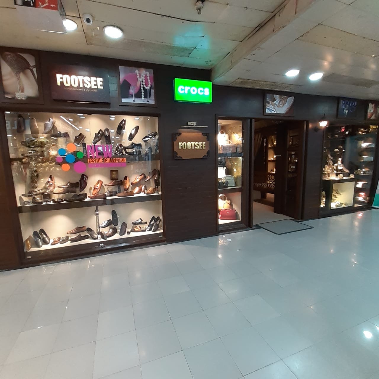 Shopping mall,Building,Retail,Footwear,Interior design,Outlet store,Shoe,Fashion accessory,Floor,Shopping