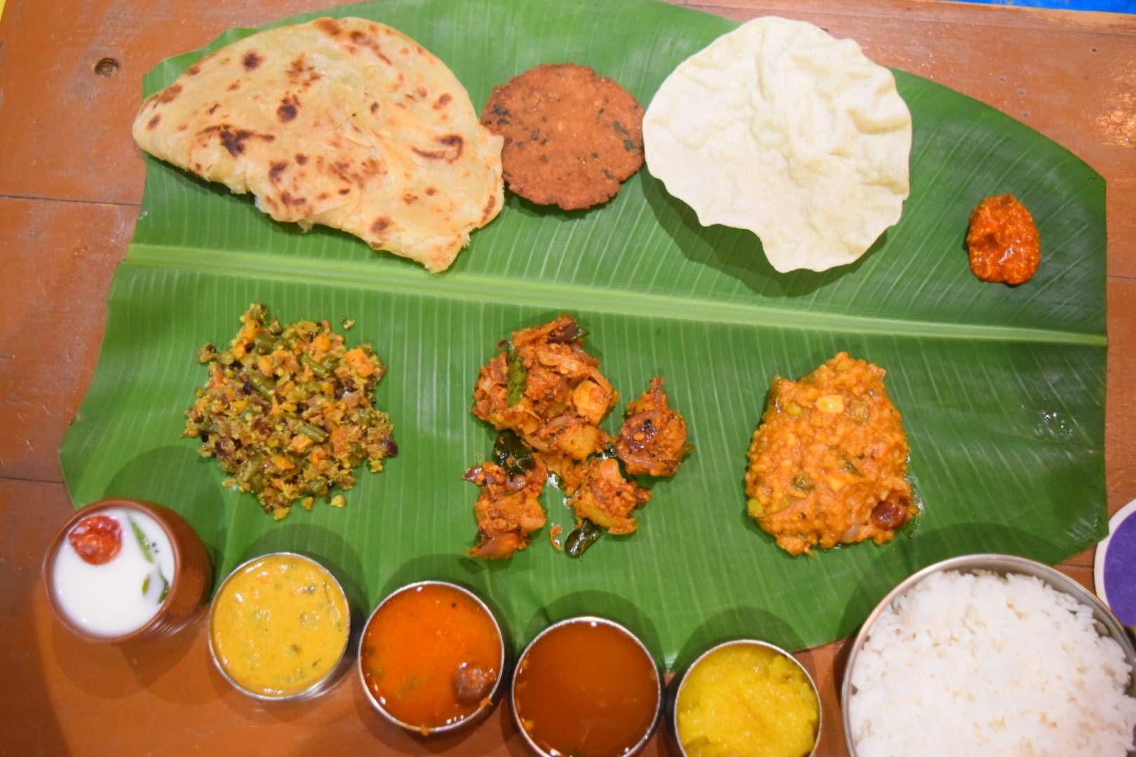 Dish,Food,Cuisine,Sadya,Ingredient,Andhra food,Banana leaf rice,Tamil food,Meal,Roti