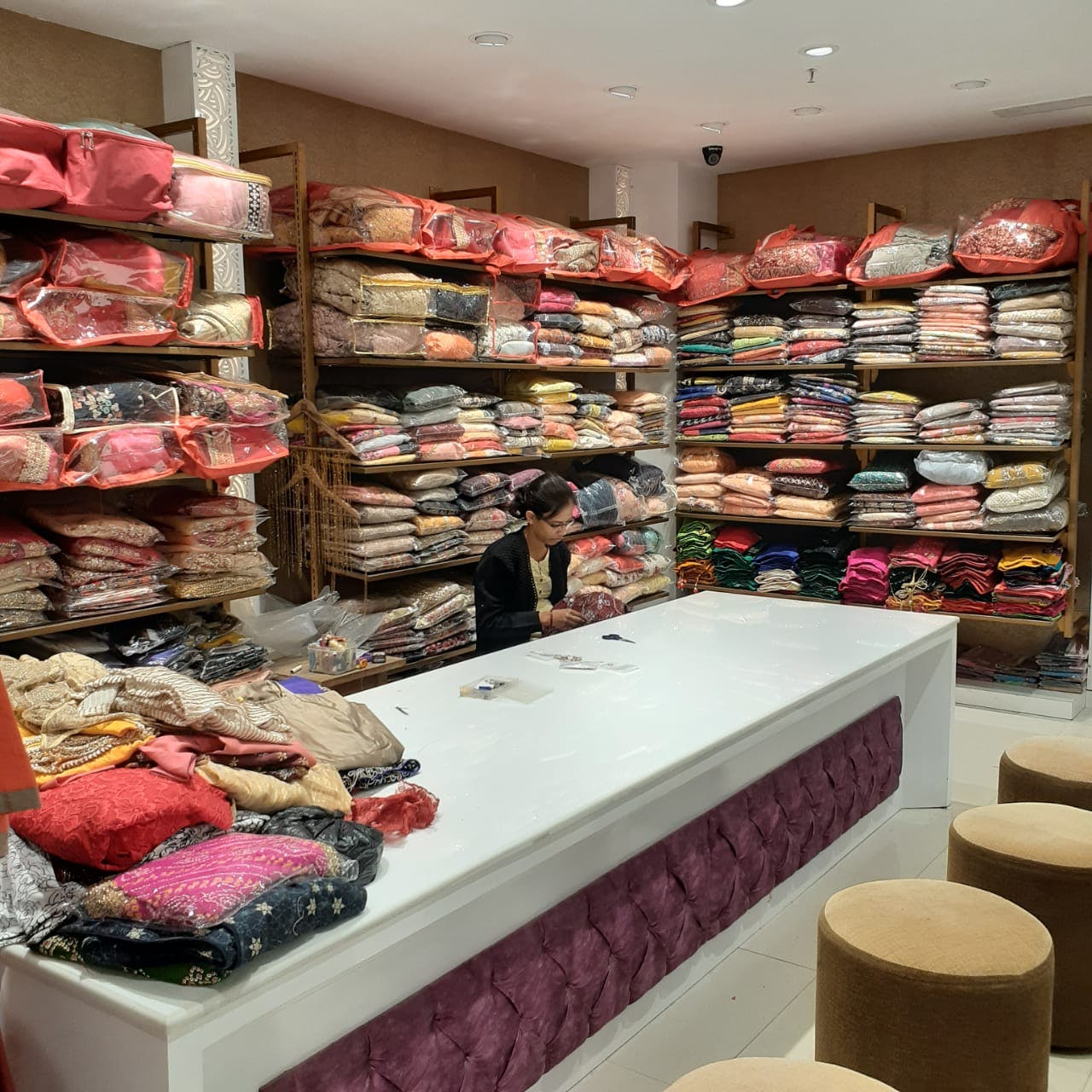 Outlet store,Pink,Interior design,Textile,Closet,Building,Retail,Room,Boutique,Furniture