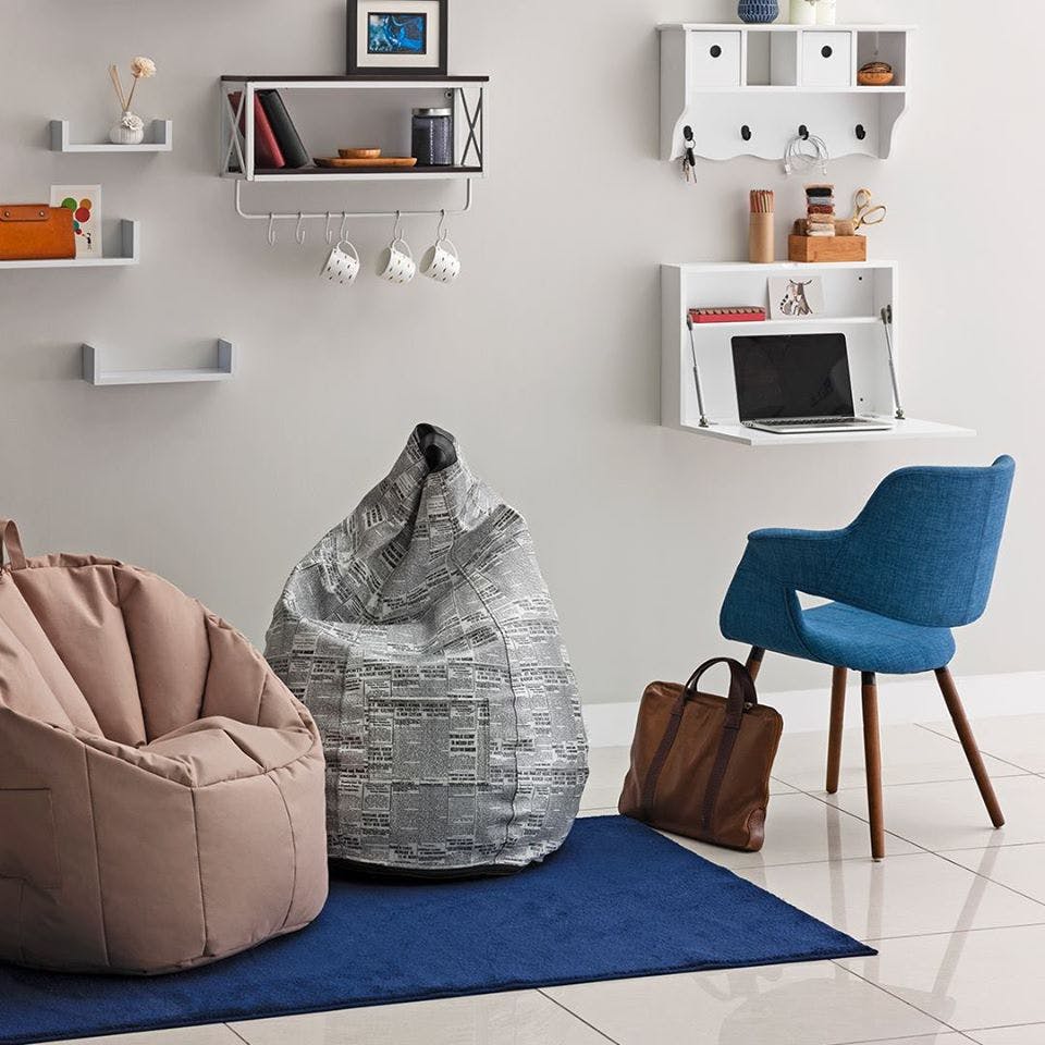 Furniture,Living room,Bean bag,Room,Interior design,Bean bag chair,Couch,Table,Shelf,Chair