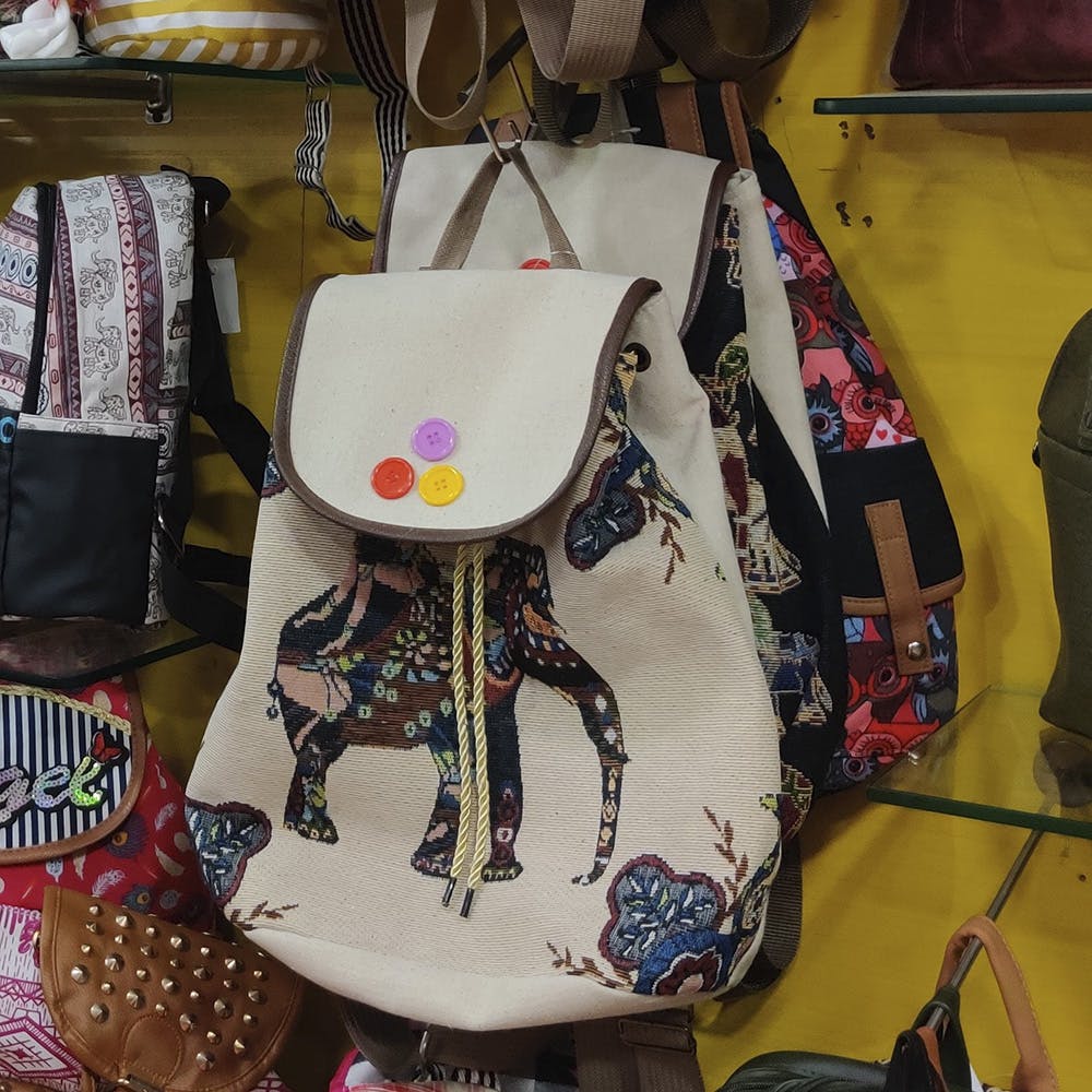Bag,Handbag,Textile,Fashion accessory,Diaper bag,Embroidery,Art
