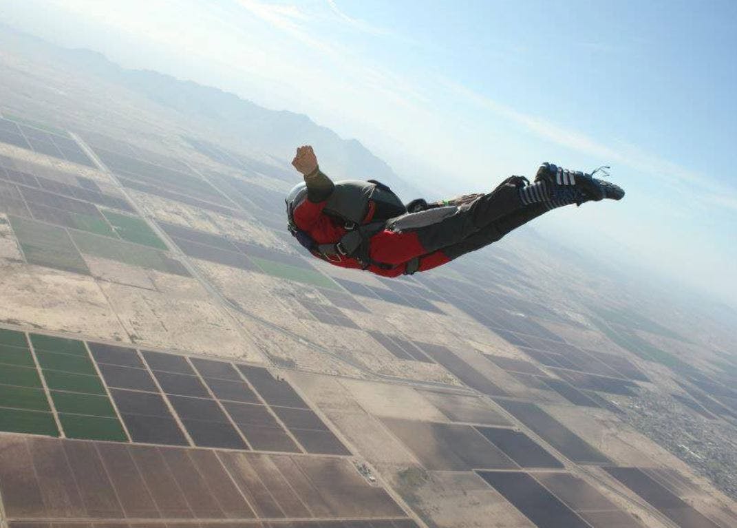 Parachuting,Air sports,Extreme sport,Sky,Flip (acrobatic),Windsports,Parachute,Fun,Stunt performer,Base jumping