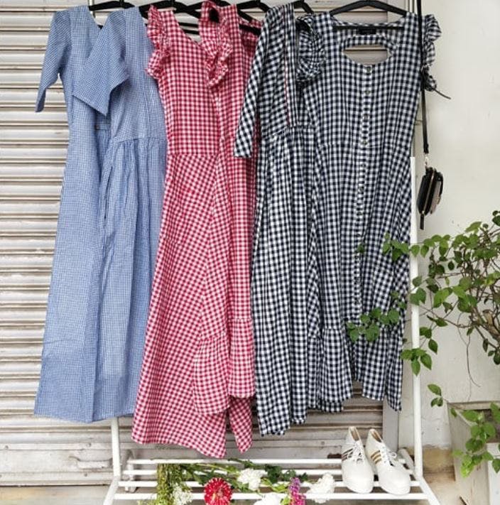 Clothing,Pink,Clothes hanger,Textile,Dress,Room,Window,Pattern,Curtain,Plaid