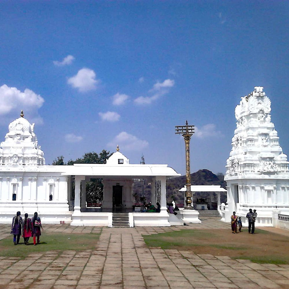Sky,Place of worship,Hindu temple,Temple,Cloud,Landmark,Building,Architecture,Historic site,Tourism