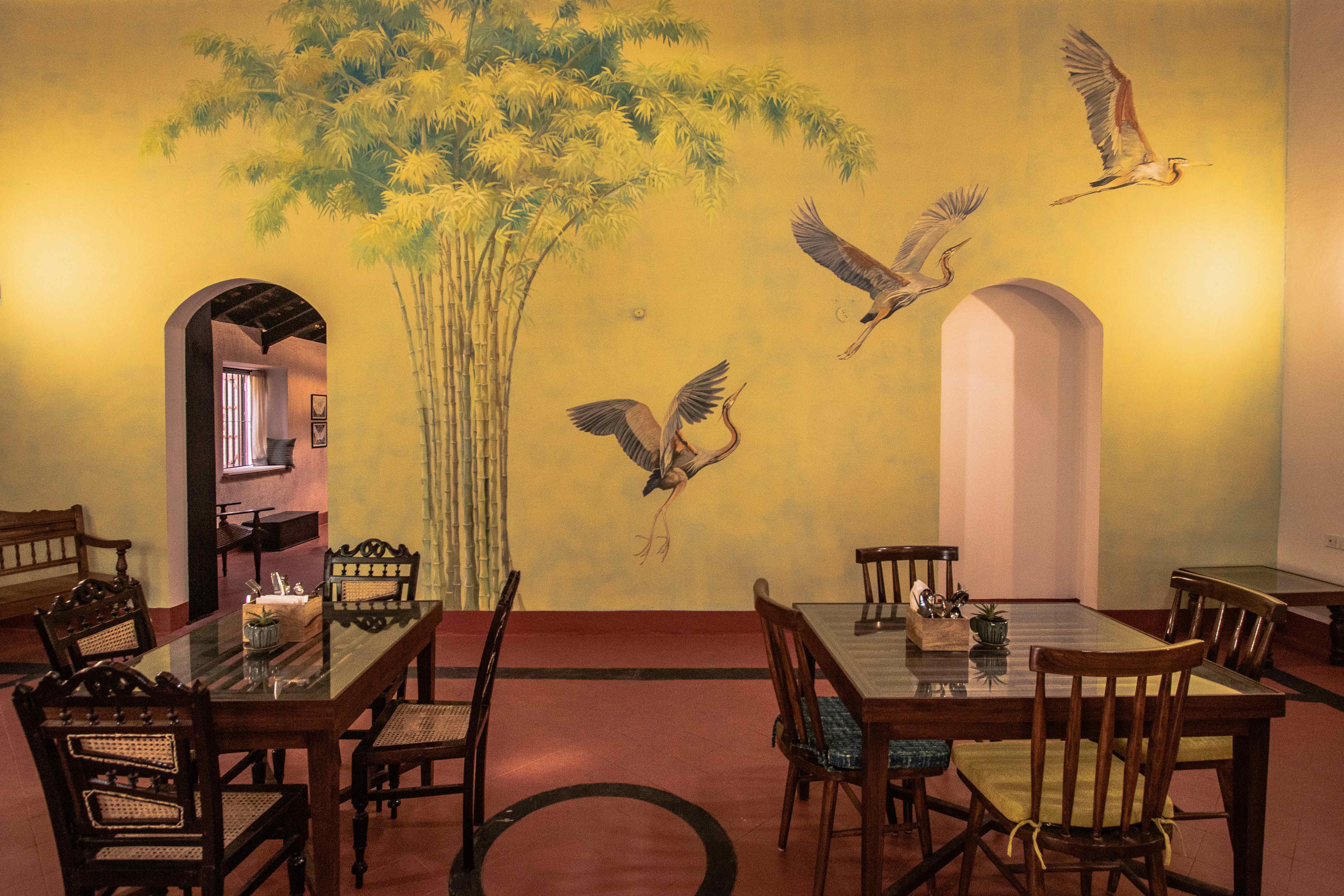 Room,Interior design,Ceiling,Table,Visual arts,Mural,Art,Restaurant,Building,Furniture