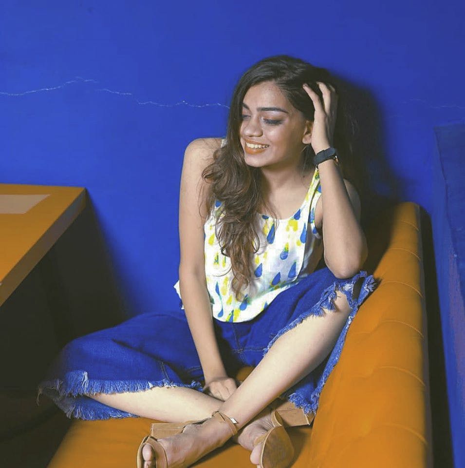 Blue,Sitting,Leg,Thigh,Human leg,Yellow,Beauty,Photo shoot,Fashion,Long hair