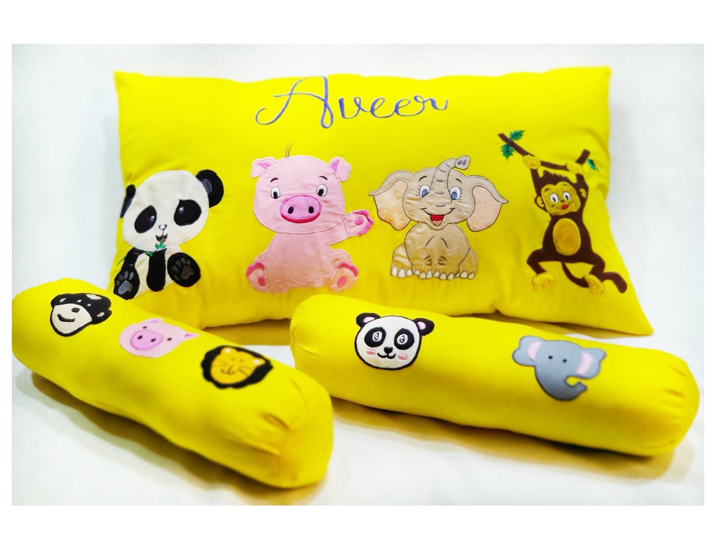 Pillow,Yellow,Cushion,Bedding,Textile,Furniture,Linens,Throw pillow,Font,Bed sheet