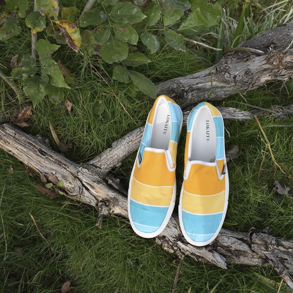 Footwear,Shoe,Yellow,Grass,Plimsoll shoe,Tree,Plant,Outdoor shoe
