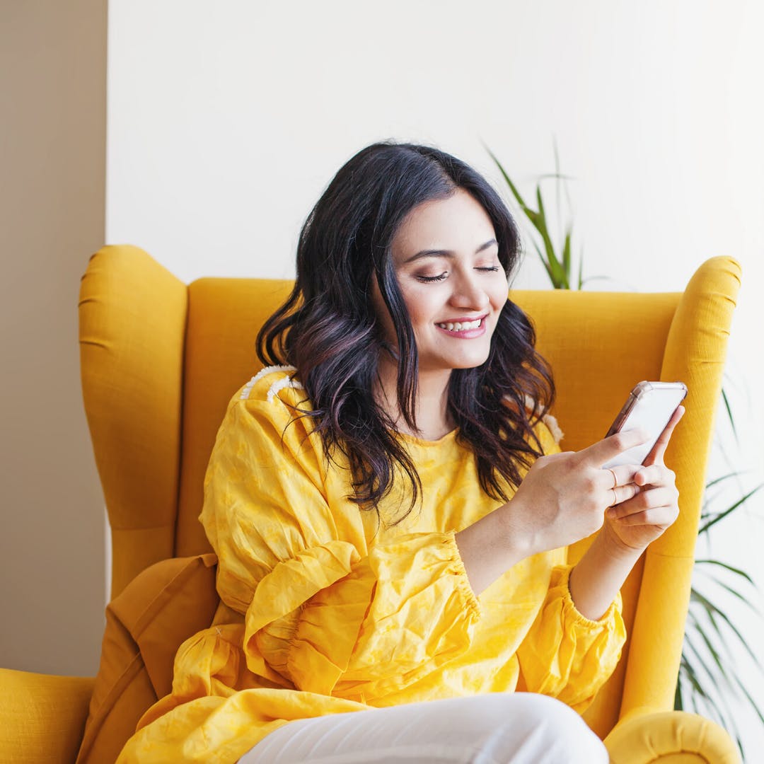 Yellow,Sitting,Technology,Electronic device,Smile,Gadget,Furniture,Happy,Room,Photography