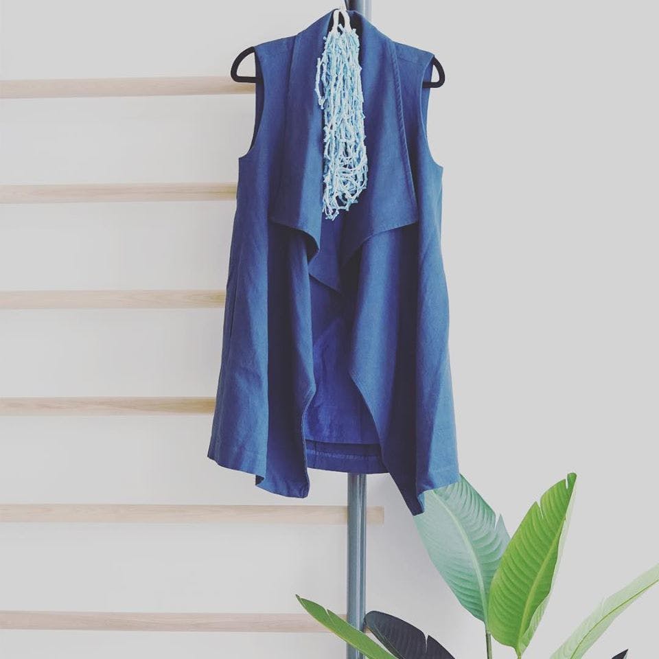 Clothing,Blue,Clothes hanger,Outerwear,Dress,Textile,Electric blue,Formal wear,Blouse,Cover-up