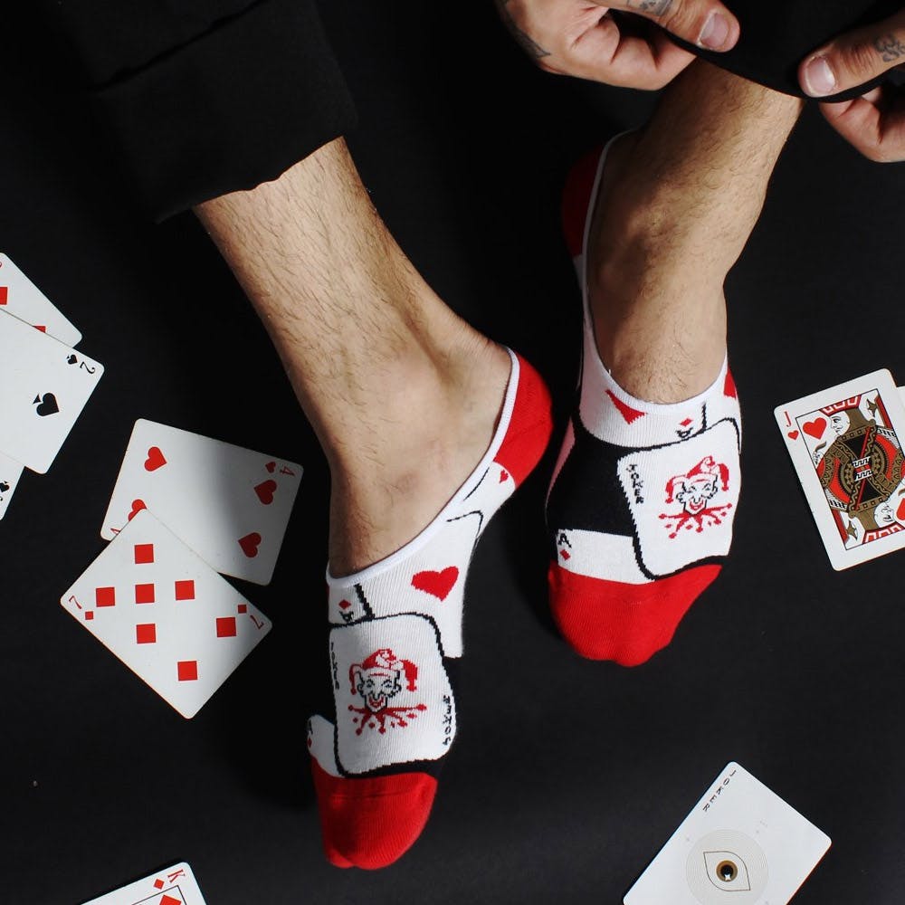 Games,Carmine,Gambling,Footwear,Recreation,Card game,Poker,Arm,Shoe,Leg