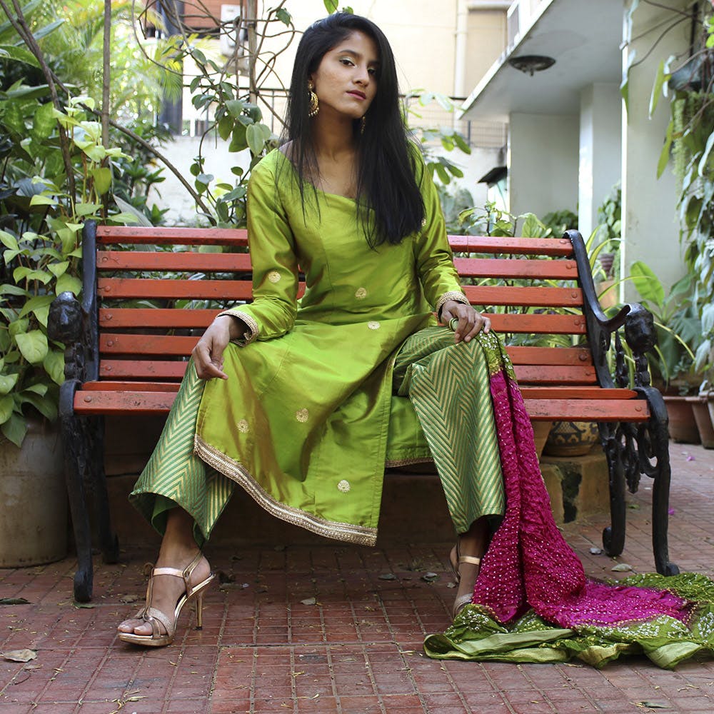 Clothing,Green,Photo shoot,Sari,Sitting,Formal wear,Textile,Silk,Magenta,Dress