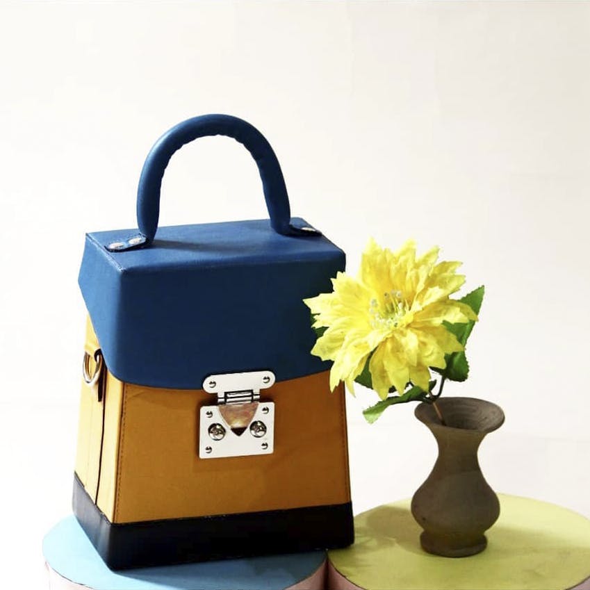 Product,Bag,Handbag,Kettle,Fashion accessory,Plant,Flower