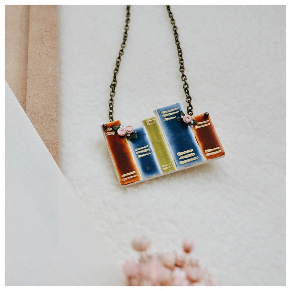 Orange,Fashion accessory,Jewellery,Turquoise,Necklace,Pendant,Rectangle,Material property,Font,Electric blue