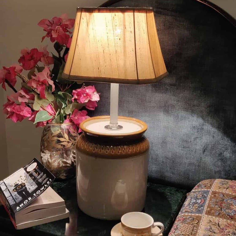 Lampshade,Lighting accessory,Lamp,Table,Lighting,Room,Interior design,Tree,Flowerpot,Furniture