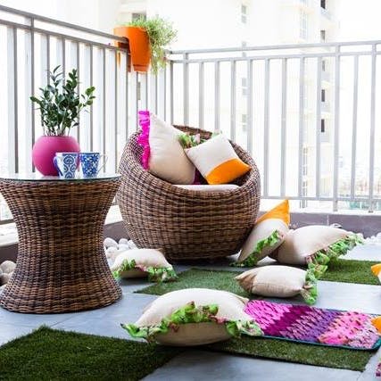 Room,Wicker,Table,Furniture,Interior design,Home,Living room,Plant,Flowerpot,Coffee table