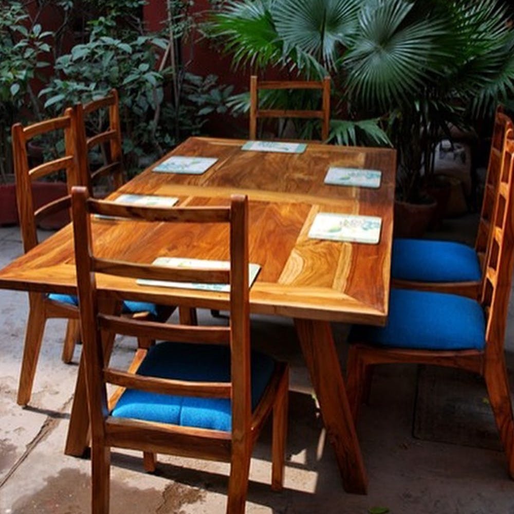 Furniture,Table,Kitchen & dining room table,Outdoor table,Chair,Outdoor furniture,Room,Dining room,Wood,Coffee table