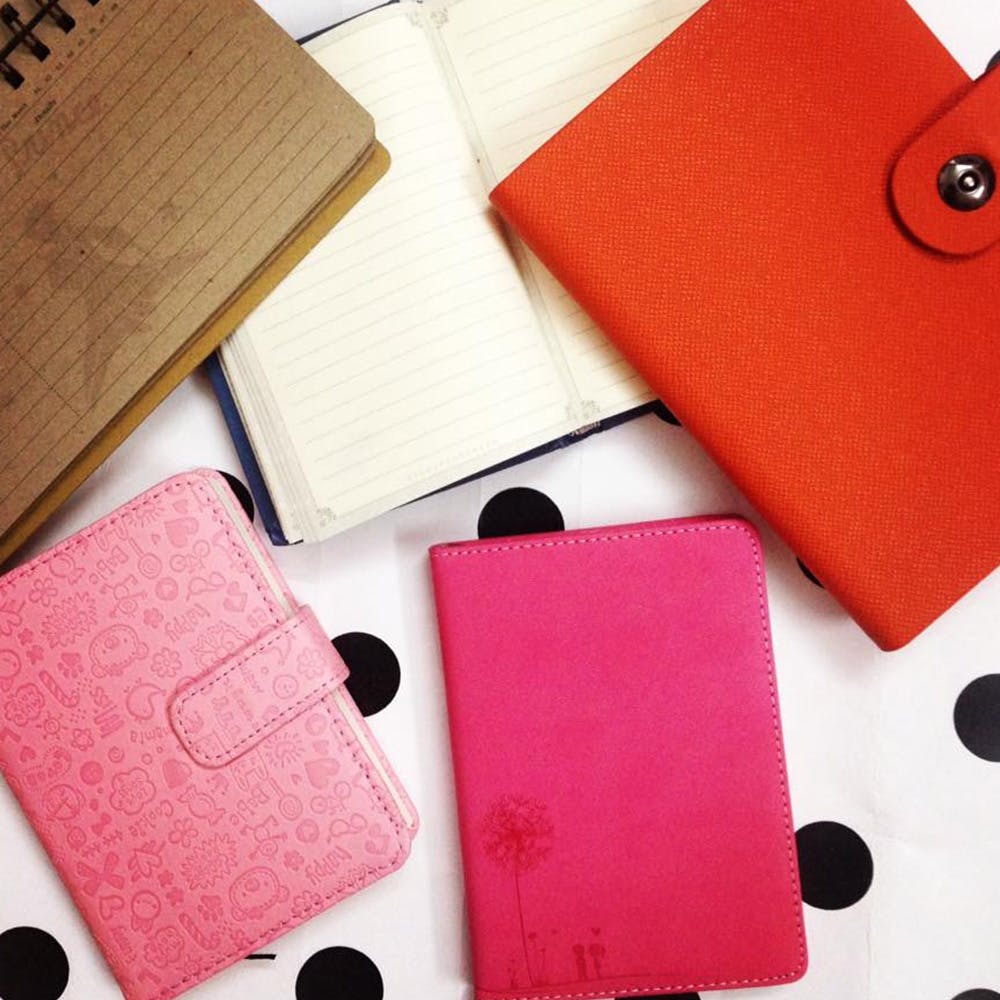 Wallet,Pink,Red,Leather,Electronic device,Technology,Gadget,Material property,Communication Device,Font