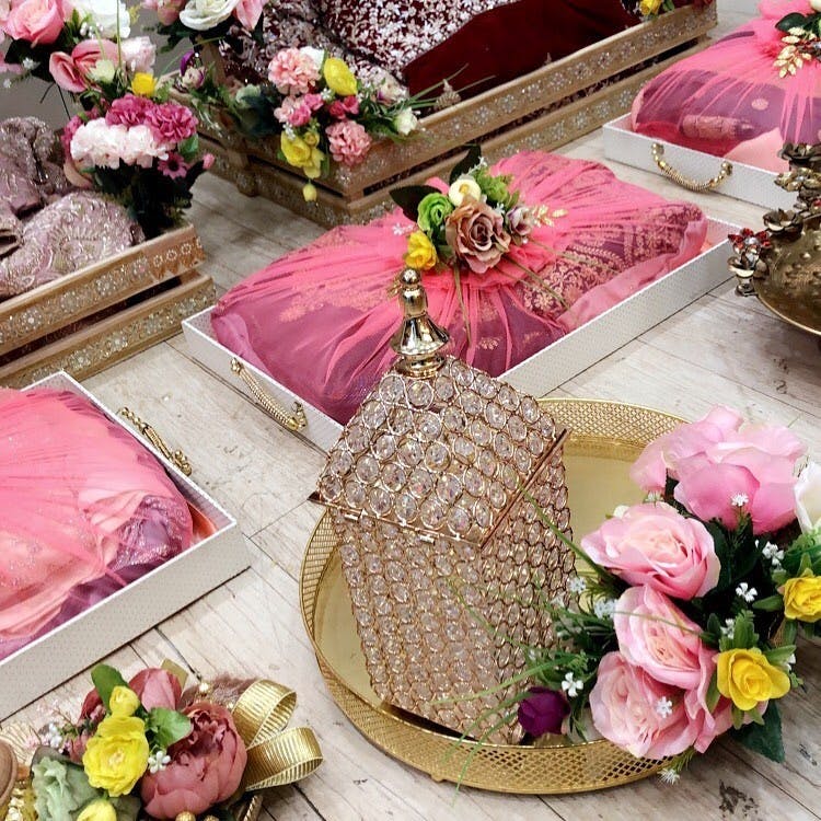 Pink,Artificial flower,Flower,Font,Plant,Table,Fashion accessory,Floral design,Floristry,Rose
