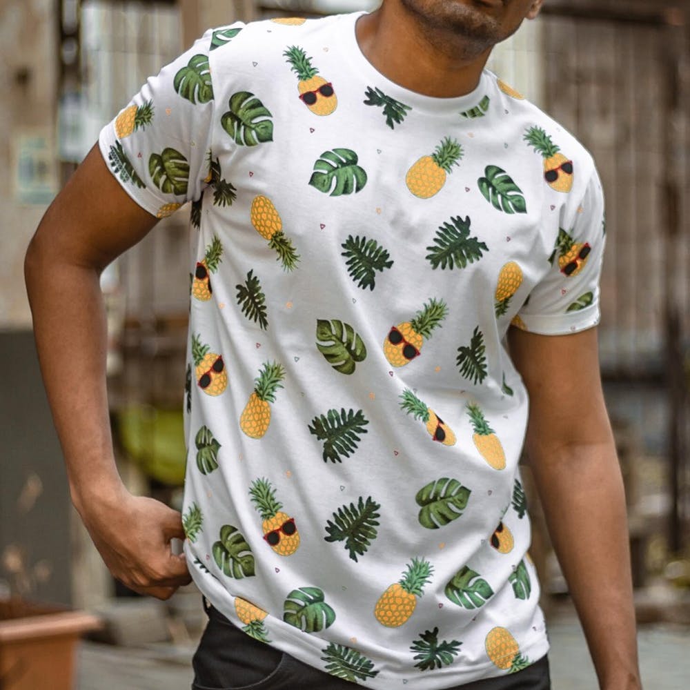 Clothing,White,T-shirt,Pineapple,Sleeve,Neck,Top,Leaf,Pattern,Plant