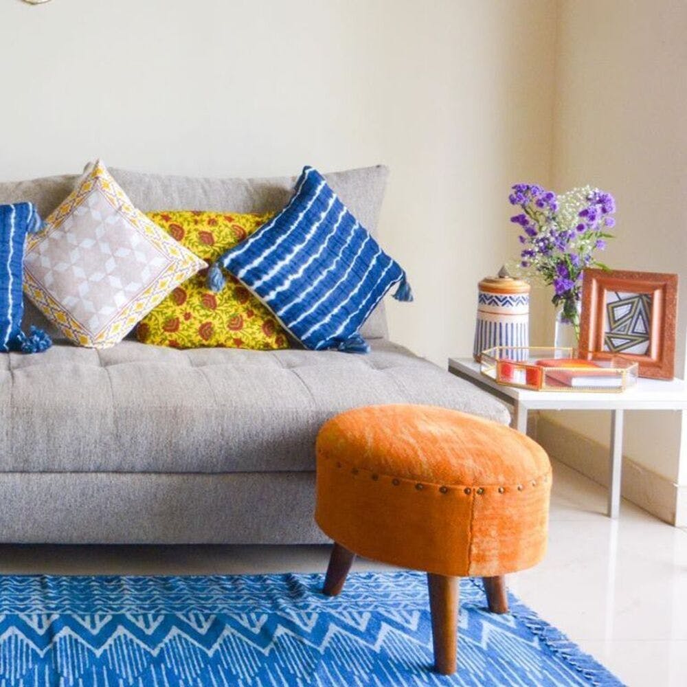 Furniture,Blue,Orange,Room,Living room,Yellow,Interior design,Couch,studio couch,Floor