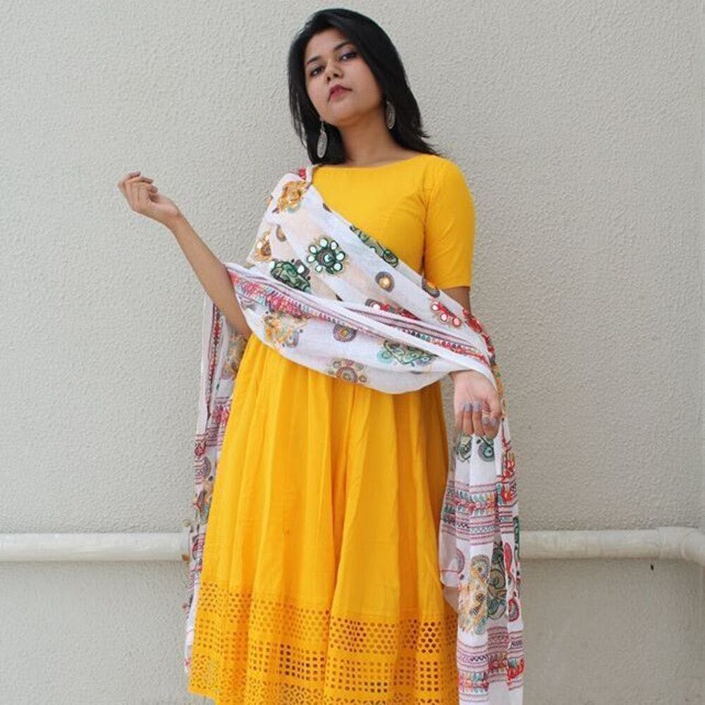 Clothing,Yellow,White,Orange,Formal wear,Textile,Dress,Sari,Neck,Sleeve