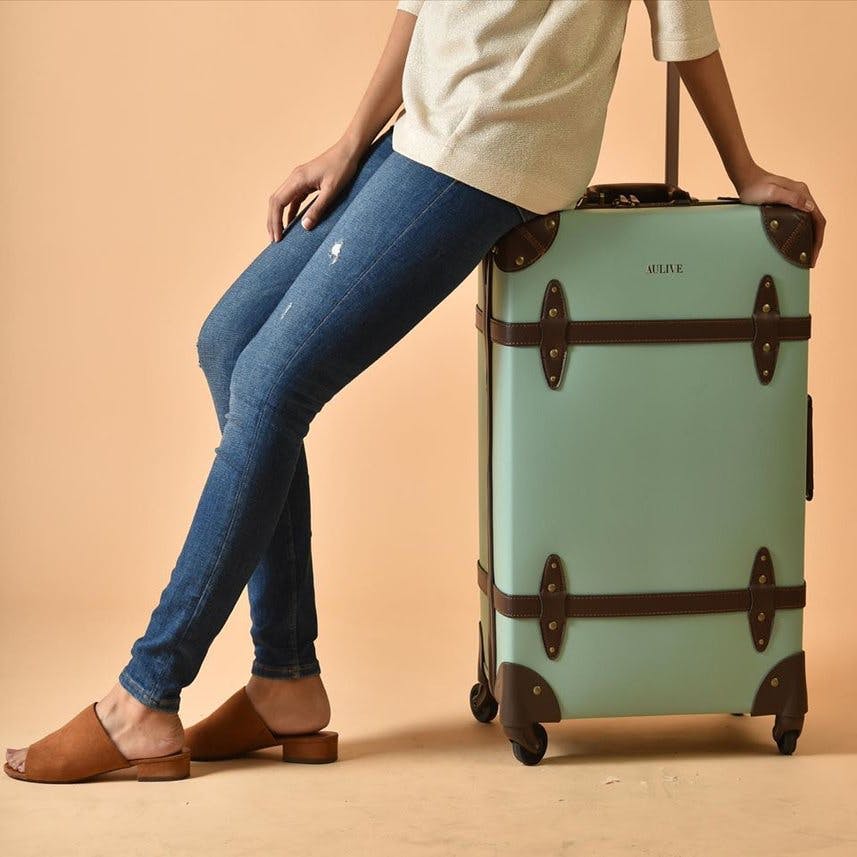 Bag,Suitcase,Shoulder,Hand luggage,Product,Baggage,Green,Leg,Standing,Luggage and bags