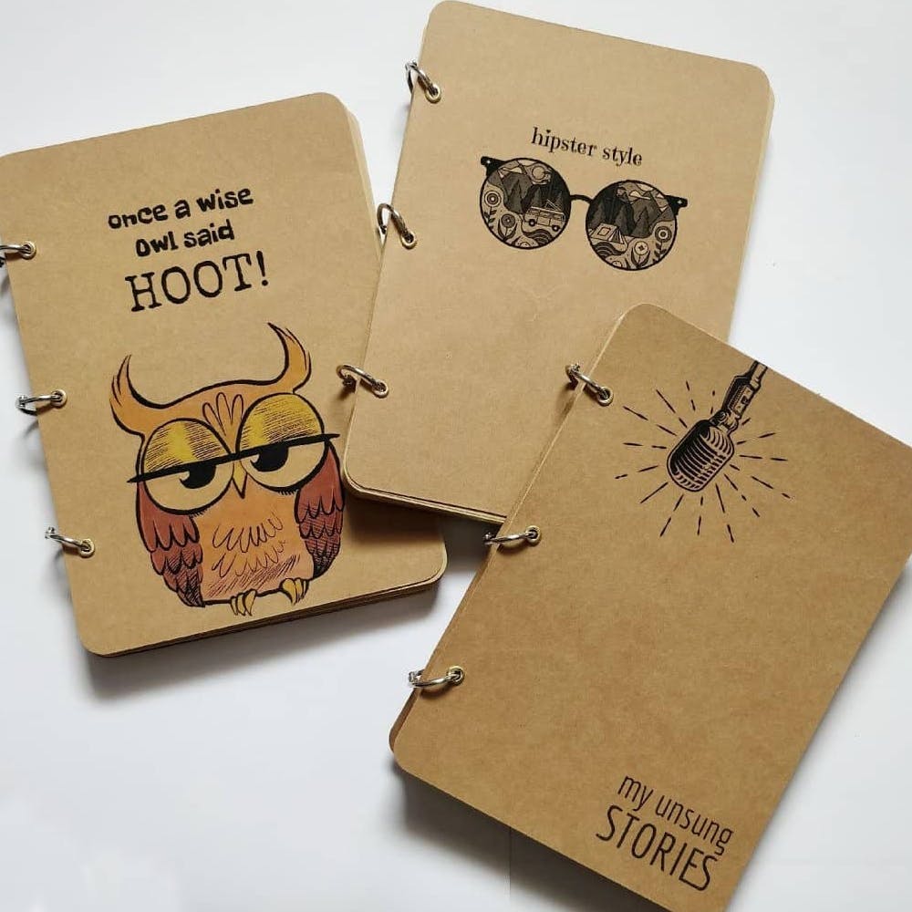 Notebook,Illustration,Paper product,Design,Font,Paper,Skull,Graphic design,Glasses,Insect