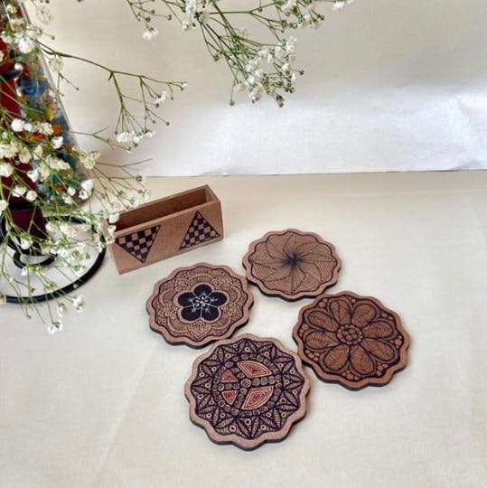 Table,Textile,Ornament,Cut flowers,Crochet,Flower,Tableware,Fashion accessory,Floral design,Artificial flower