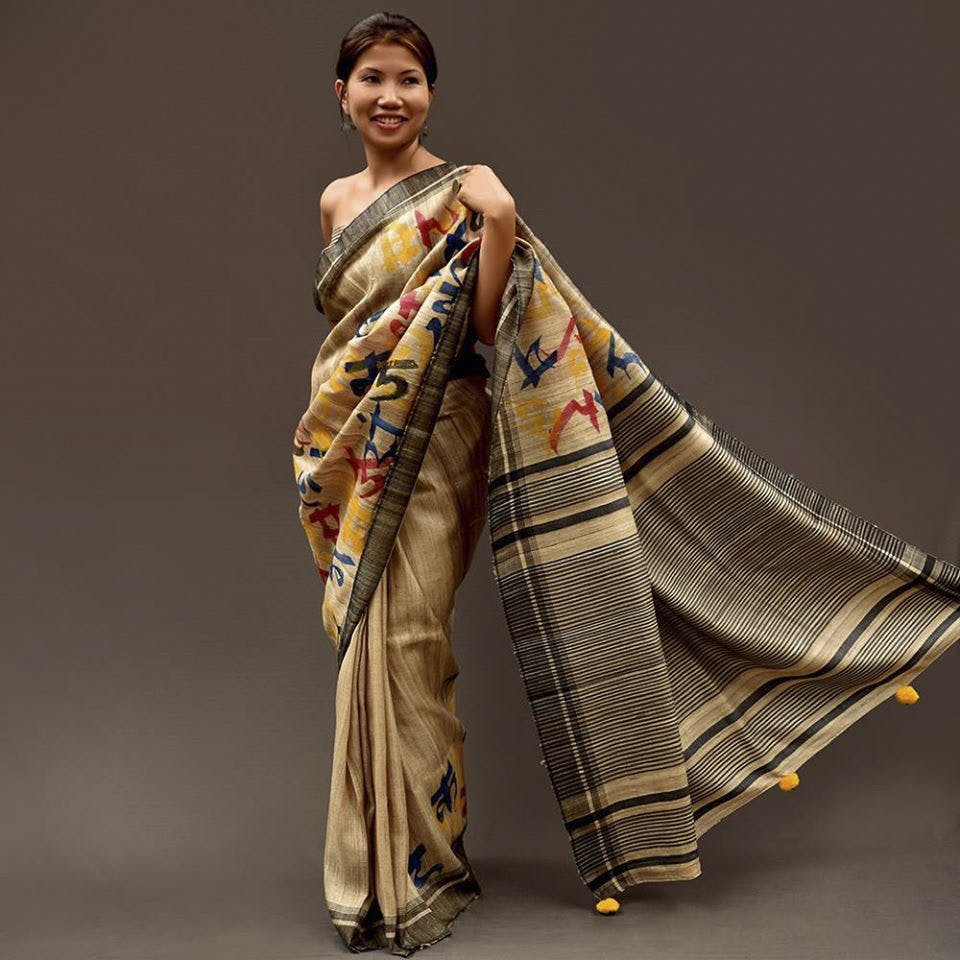Clothing,Sari,Fashion model,Silk,Yellow,Formal wear,Beige,Fashion,Fashion design,Textile