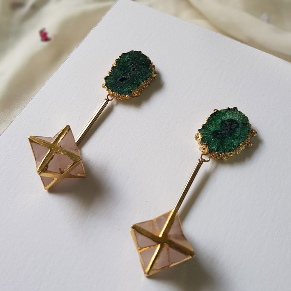 Body jewelry,Earrings,Jewellery,Fashion accessory,Emerald,Gemstone,Gold,Diamond,Crystal,Metal