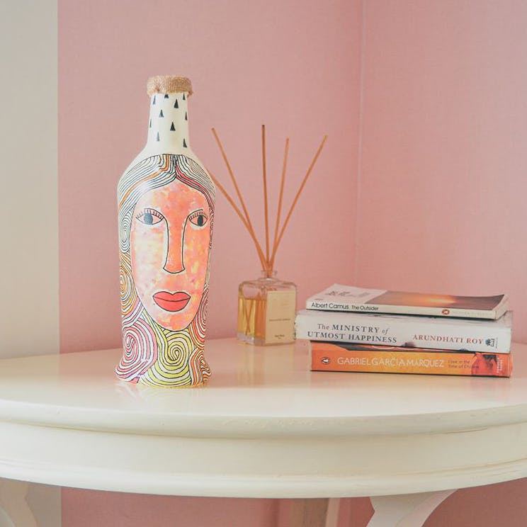 Shelf,Pink,Room,Furniture,Ceramic,Table,Peach,Interior design,Shelving,Vase