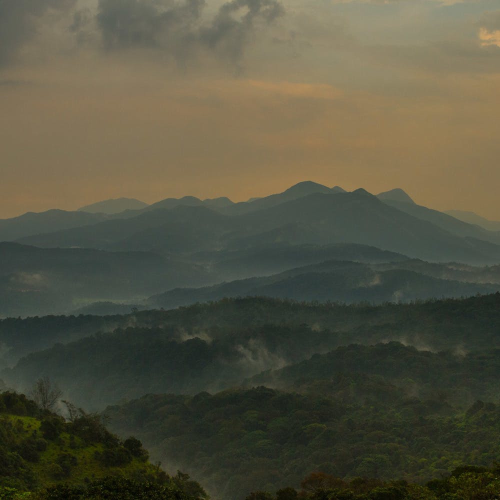 Cloud,Sky,Mountain,Atmosphere,Plant community,Ecoregion,Natural landscape,Highland,Sunrise,Landscape